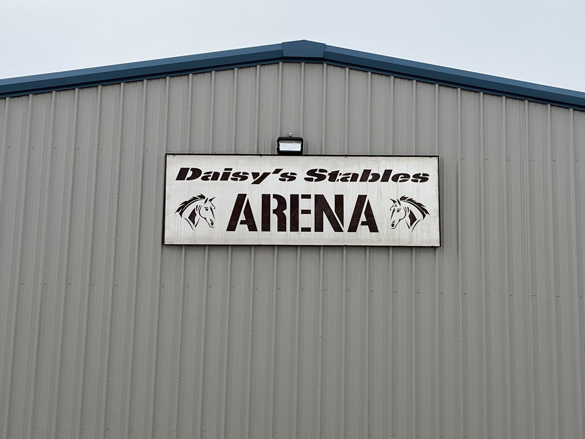 The Daisy's Stables Arena sign